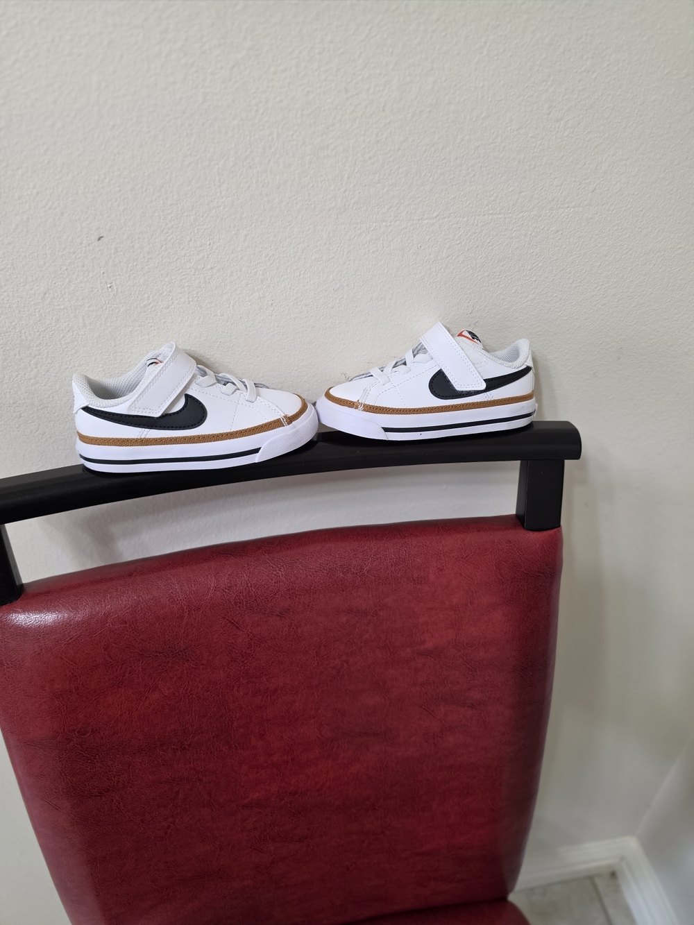 Nike Kids White Sneakers with Black Swoosh and Brown Trim